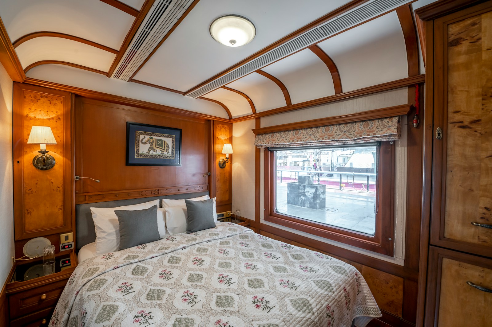 Polished vintage dining car interior with white-tablecloth tables and period details